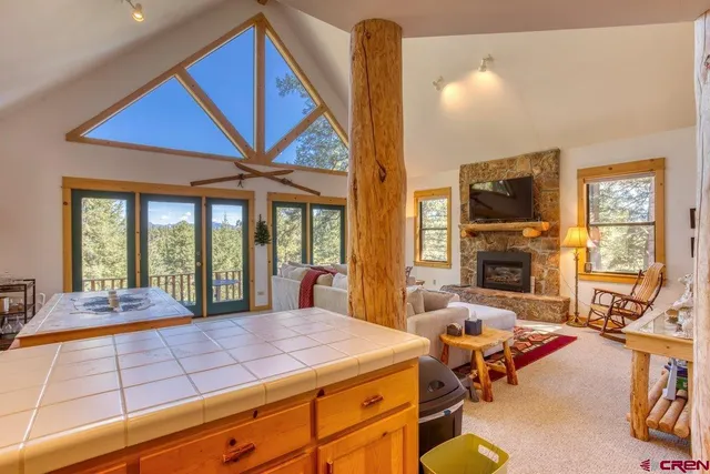 a spacious bedroom with a large bed and a large window