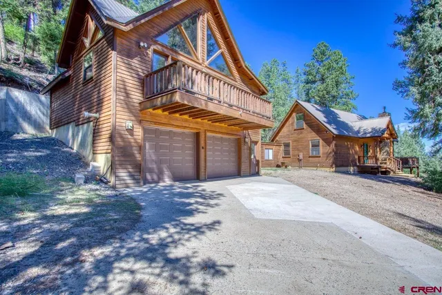 a view of house with yard and entertaining space