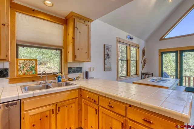 a bedroom with a bed and a lamp on table