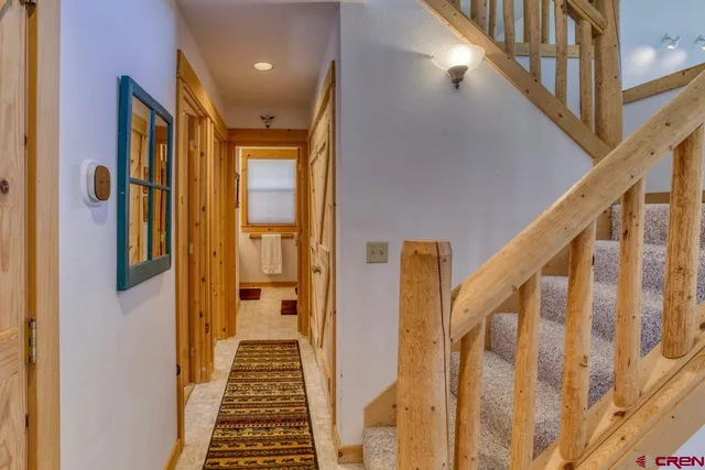a view of a room with furniture and wooden floor