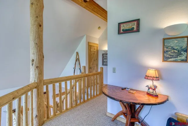 a living room with furniture and a lamp