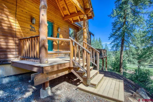 a view of balcony with two chairs and a table