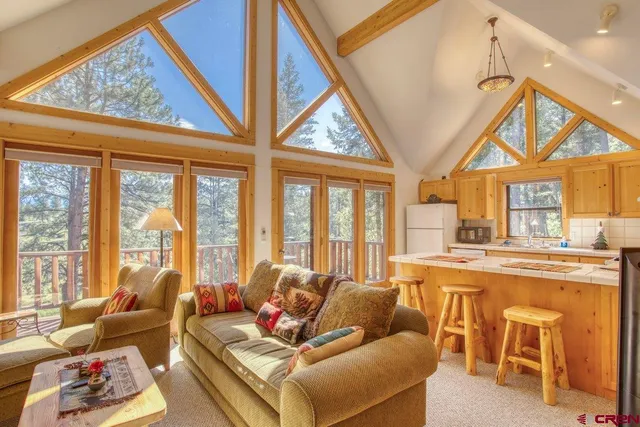 a bedroom with a bed chair and window