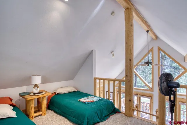 a view of a table and chairs under an umbrella