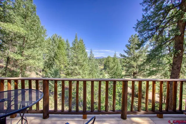 a balcony with wooden floor