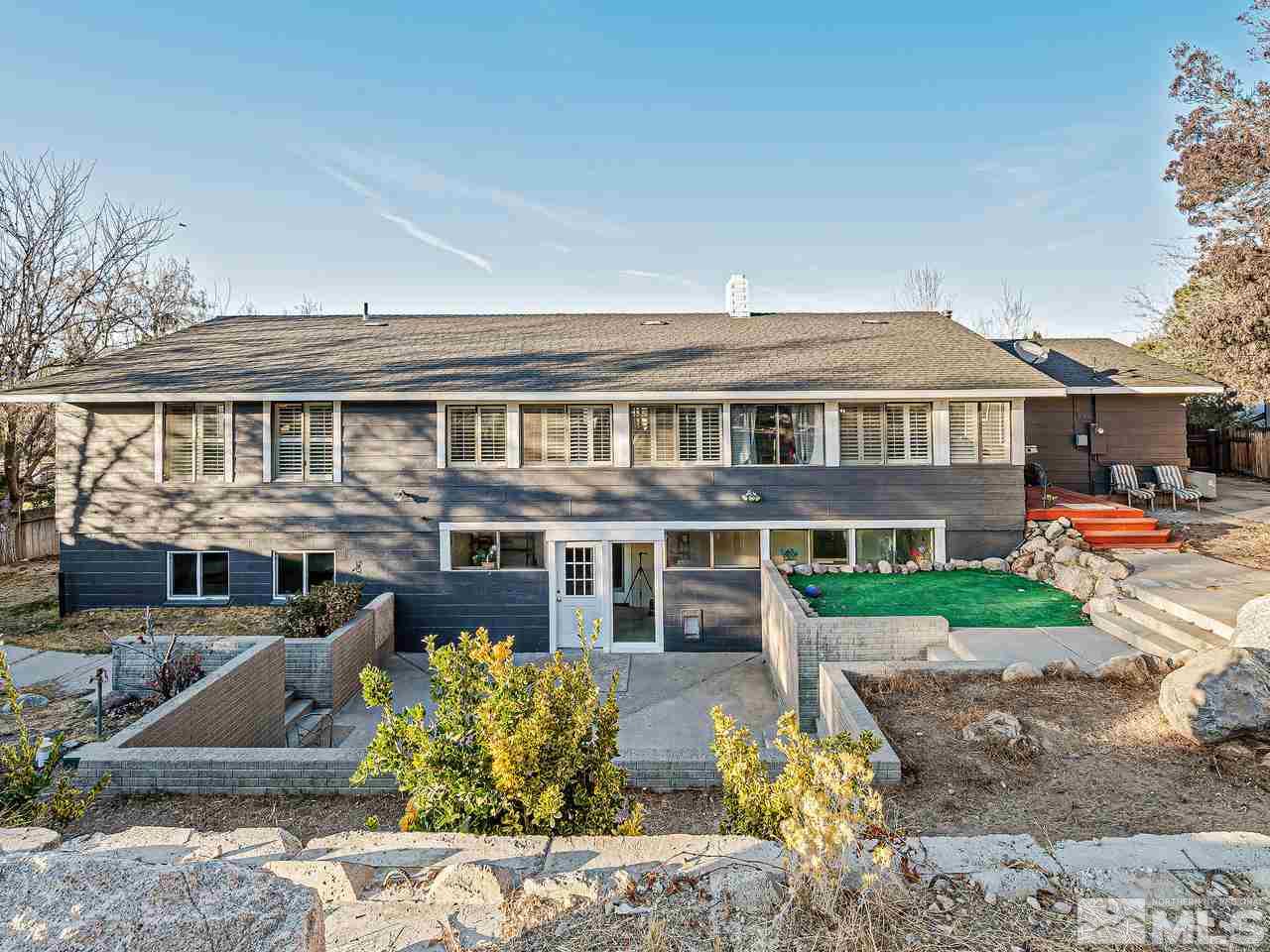 13440 Rim Rock Drive Reno, NV 89521 - Photo 23 of 25 a front view of a house with a yard