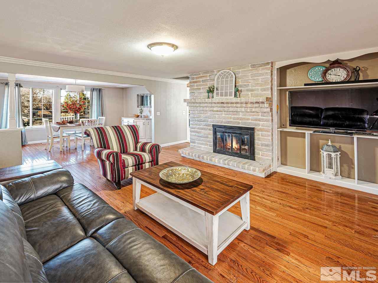 13440 Rim Rock Drive Reno, NV 89521 - Photo 7 of 25 a living room with furniture and a fireplace