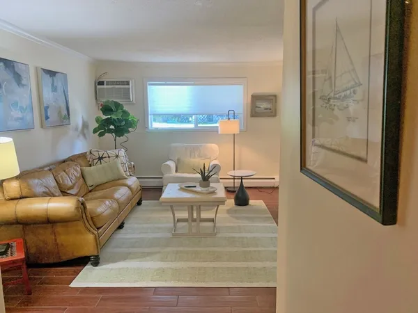 a living room with furniture and a table