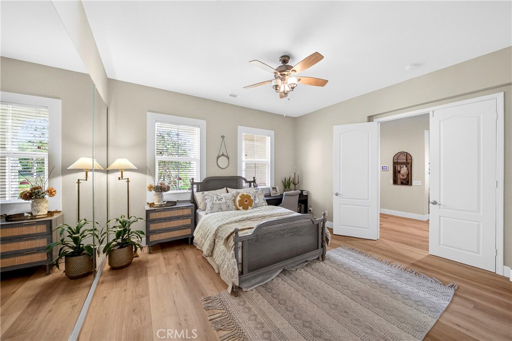 16375 Ory Circle Riverside, CA 92503 - Photo 24 of 51 a bed room with a bed and a chandelier