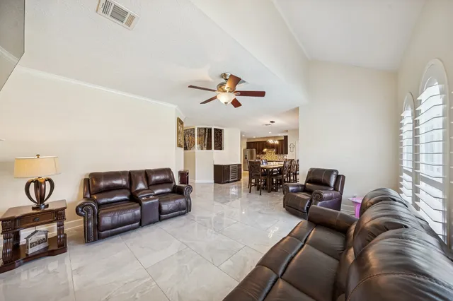 a spacious bathroom with a double vanity sink a mirror and a shower