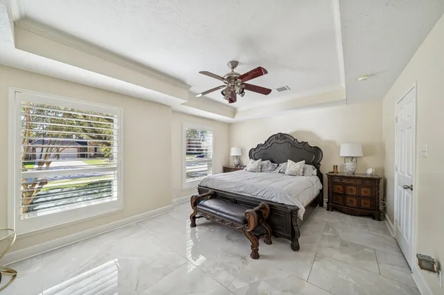 a bathroom with a tub shower sink and mirror