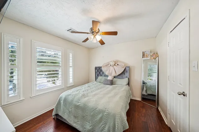 a view of a house with backyard sitting area and garden
