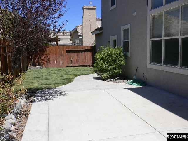 9629 Truckee Meadows Place Reno, NV 89521 - Photo 2 of 8 a view of a backyard with potted plants