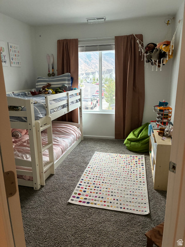673 West 1920 South, Unit 1063 Provo, UT 84601 - Photo 11 of 15 Carpeted room with a large window, offering distant mountain scenery