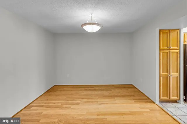 a view of a hallway with washer and dryer