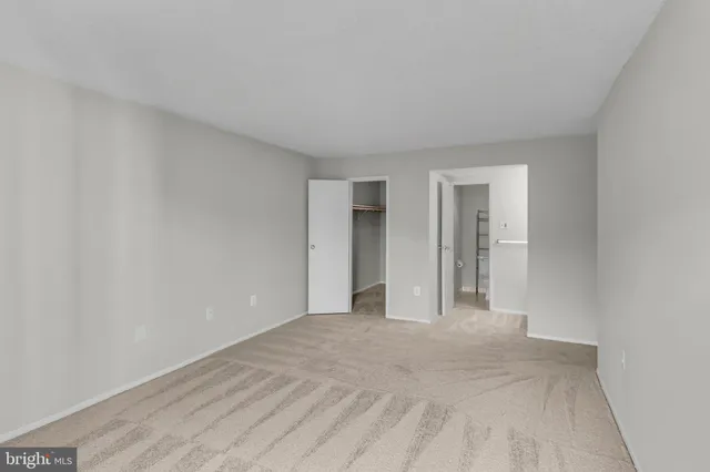 a view of an empty walk in closet