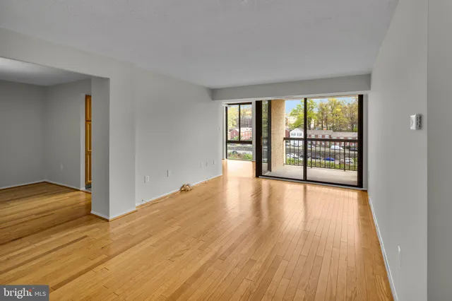 a view of a room with wooden floor