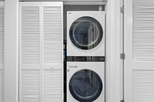 a view of a hallway with washer and dryer