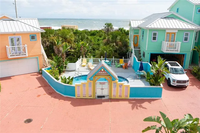 a view of roof deck with table and chairs potted plants