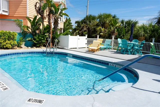 a view of a backyard with sitting area