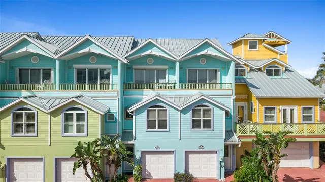 an aerial view of residential houses with city view