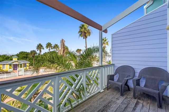 a view of a chairs and table in patio