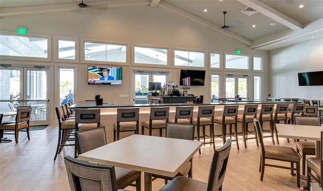 an aerial view of a pool and chairs
