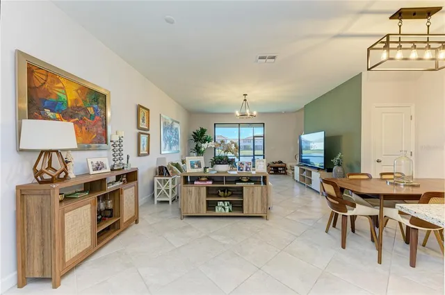 a kitchen with stainless steel appliances a stove a sink and a refrigerator