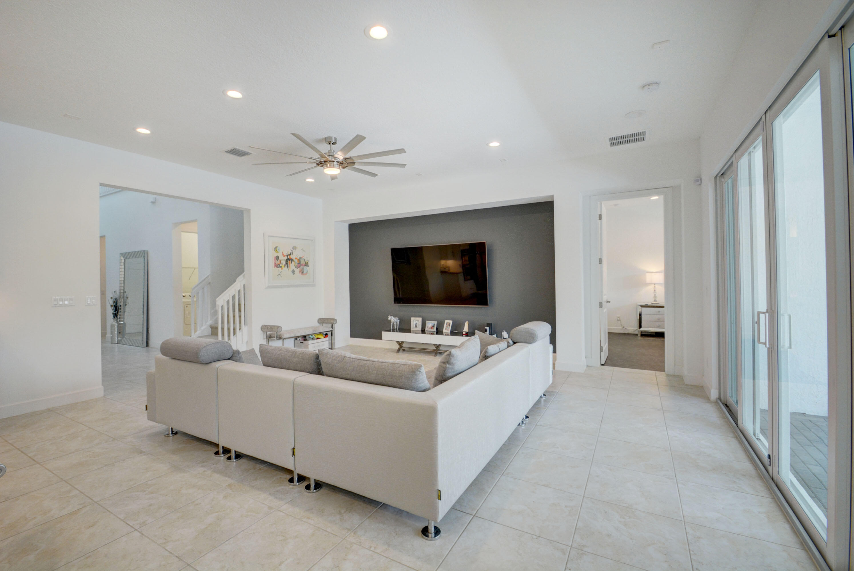 5251 Beland Drive Lake Worth, FL 33467 - Photo 12 of 56 a living room with furniture and a flat screen tv