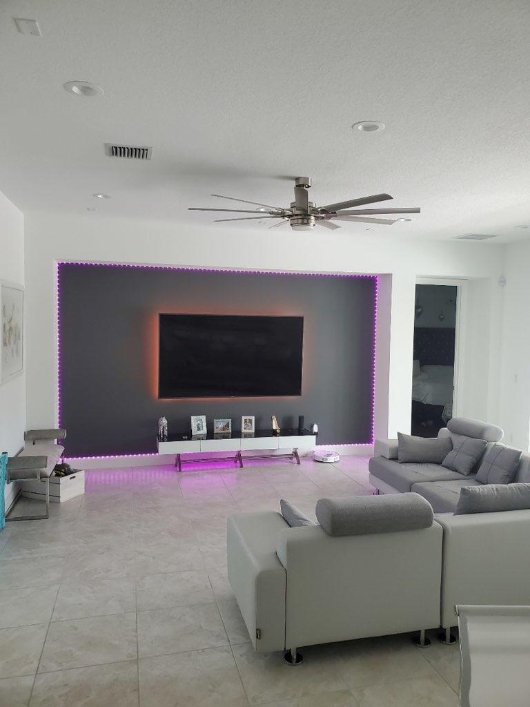 5251 Beland Drive Lake Worth, FL 33467 - Photo 15 of 56 a bedroom with furniture and a flat screen tv