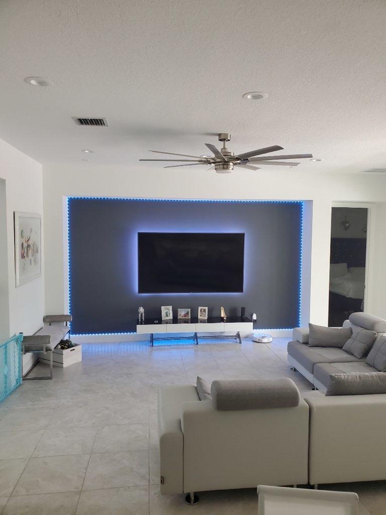 5251 Beland Drive Lake Worth, FL 33467 - Photo 17 of 56 a living room with a couch and a flat screen tv