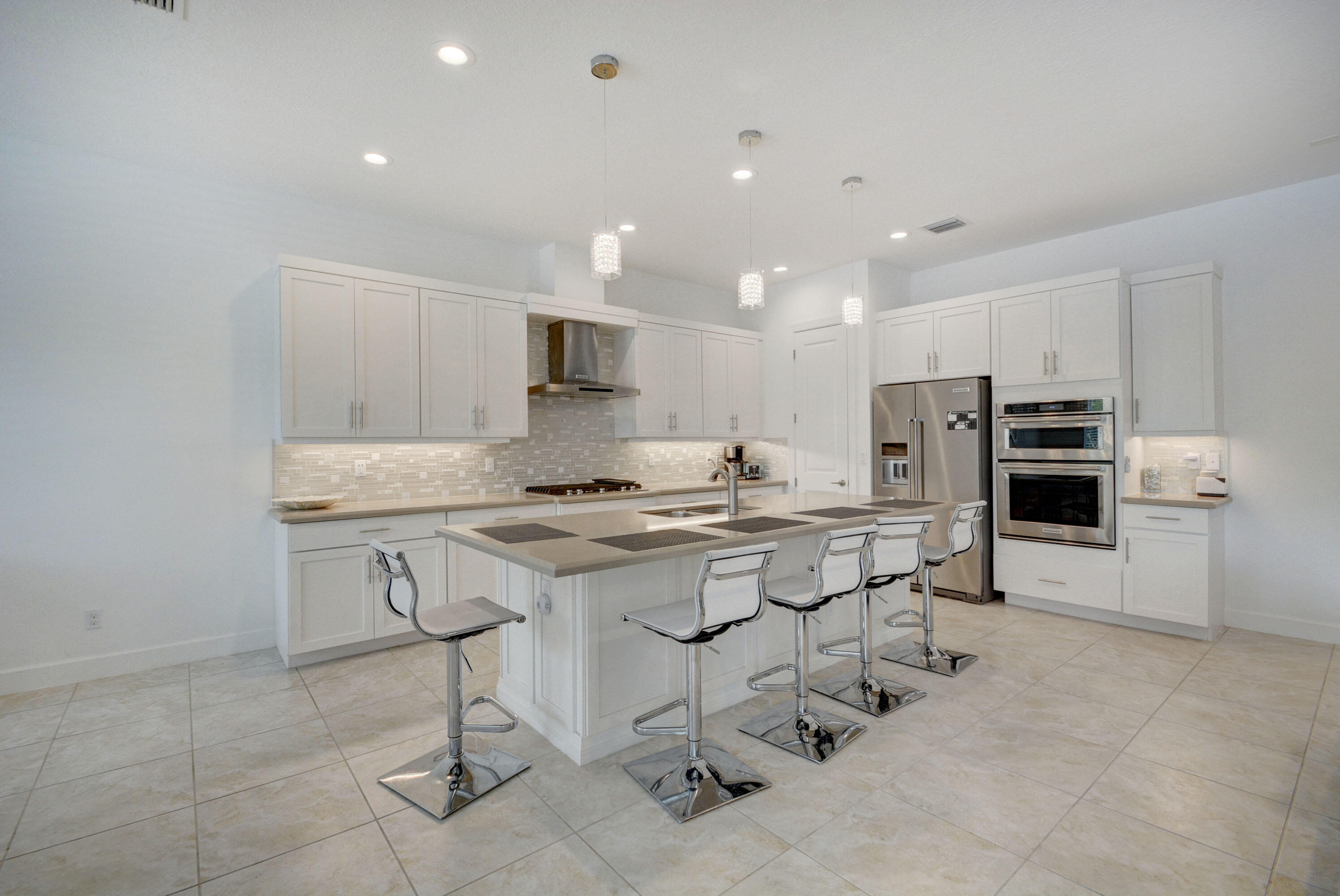 5251 Beland Drive Lake Worth, FL 33467 - Photo 18 of 56 a kitchen with appliances a sink and cabinets