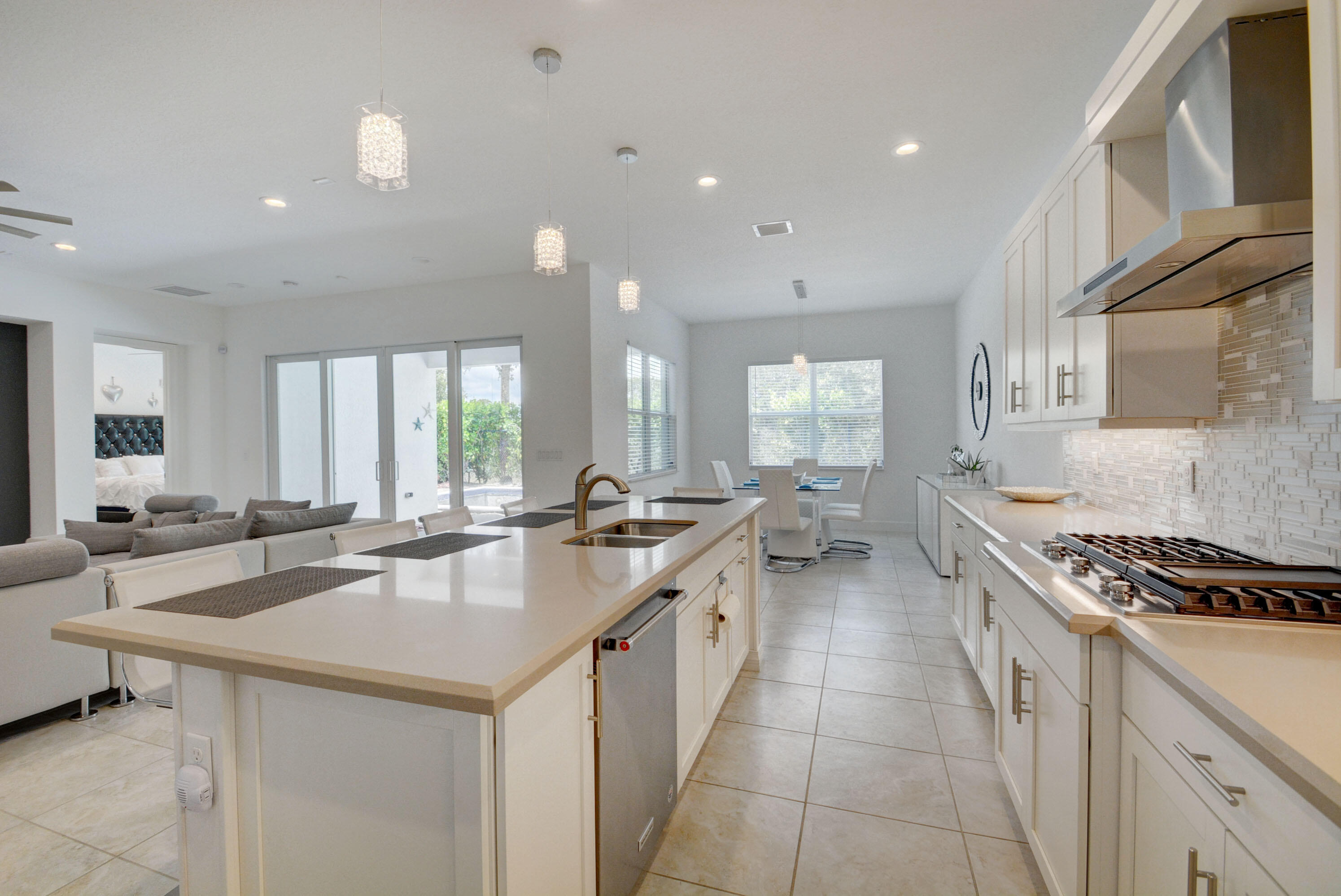5251 Beland Drive Lake Worth, FL 33467 - Photo 20 of 56 a kitchen with lots of counter top space a sink and appliances
