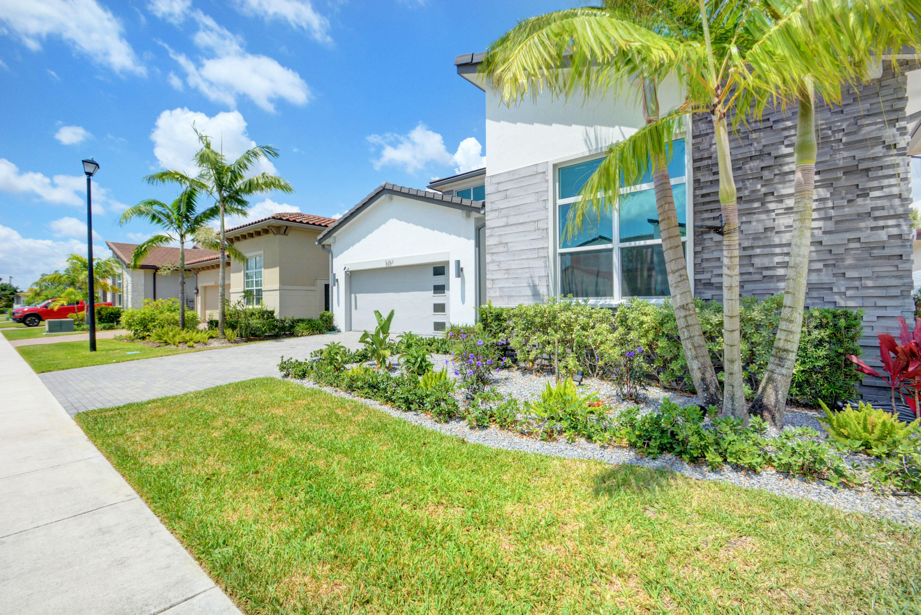 5251 Beland Drive Lake Worth, FL 33467 - Photo 3 of 56 a view of house with swimming pool outdoor seating