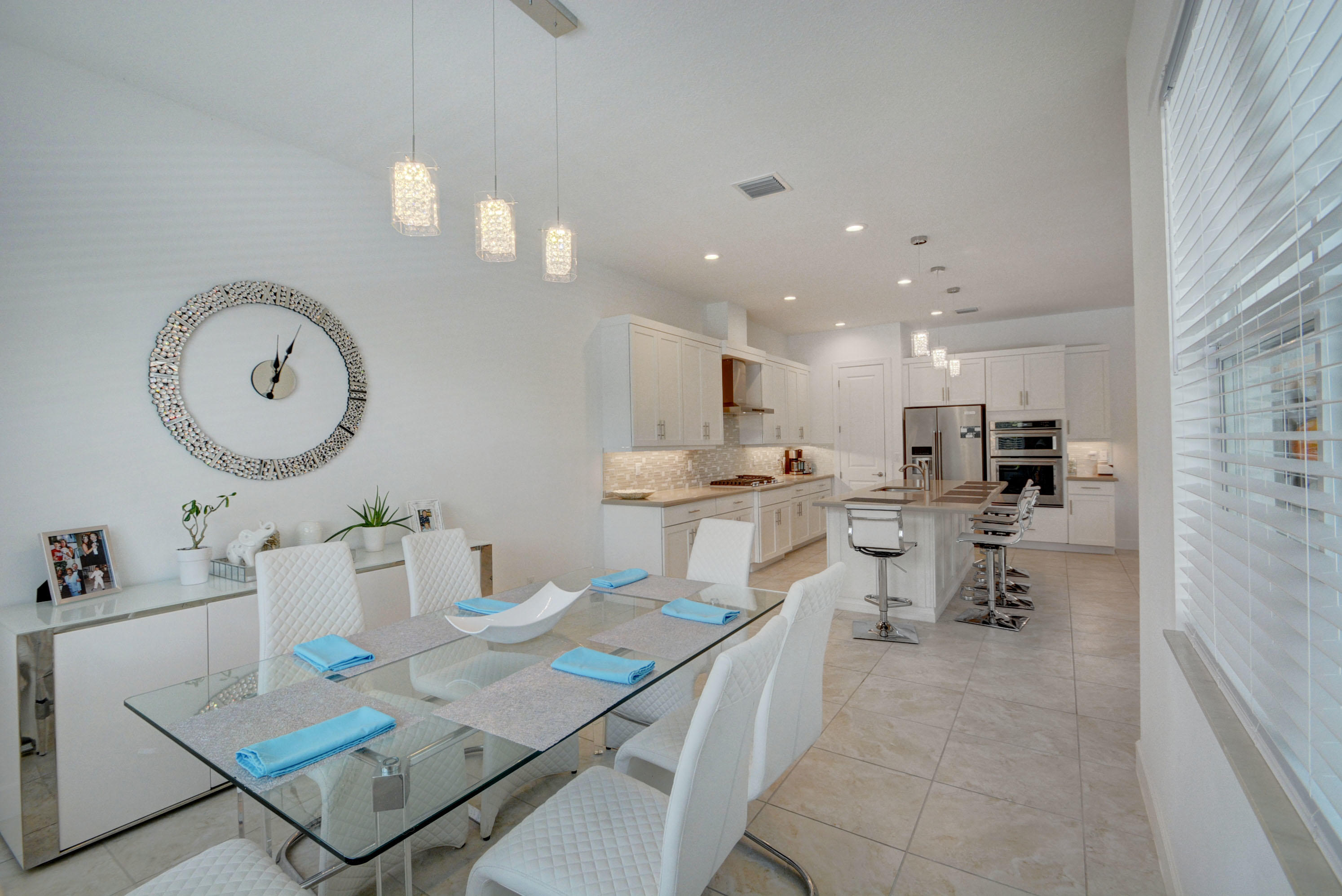 5251 Beland Drive Lake Worth, FL 33467 - Photo 25 of 56 a large kitchen with a table and chairs