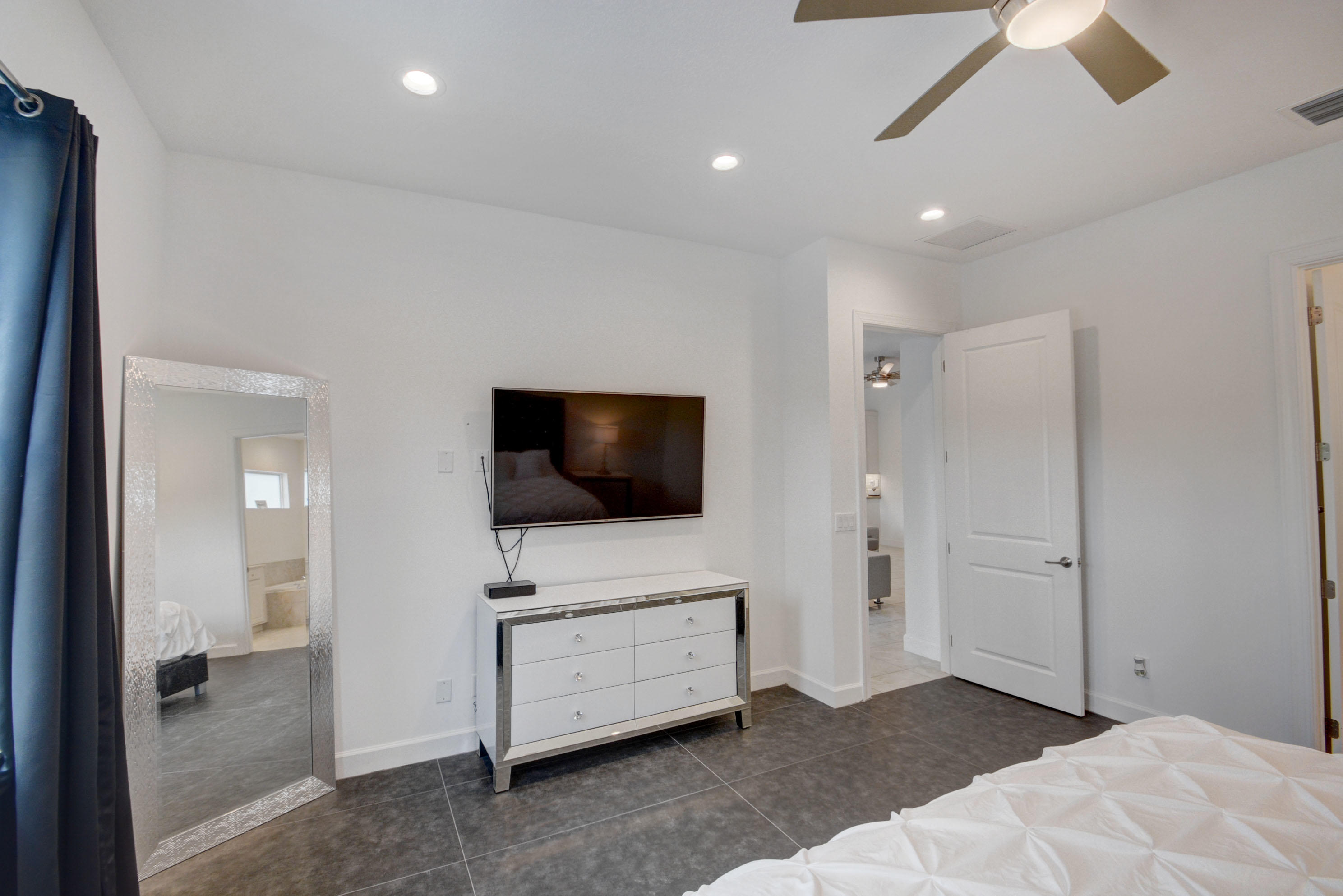 5251 Beland Drive Lake Worth, FL 33467 - Photo 29 of 56 a living room with furniture and a flat screen tv