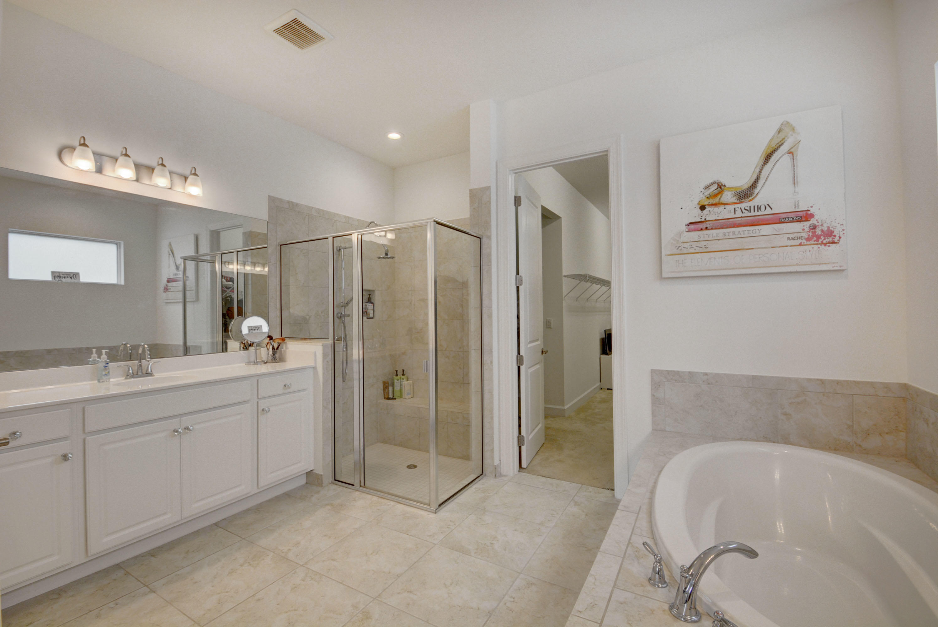 5251 Beland Drive Lake Worth, FL 33467 - Photo 30 of 56 a spacious bathroom with a tub sink and mirror