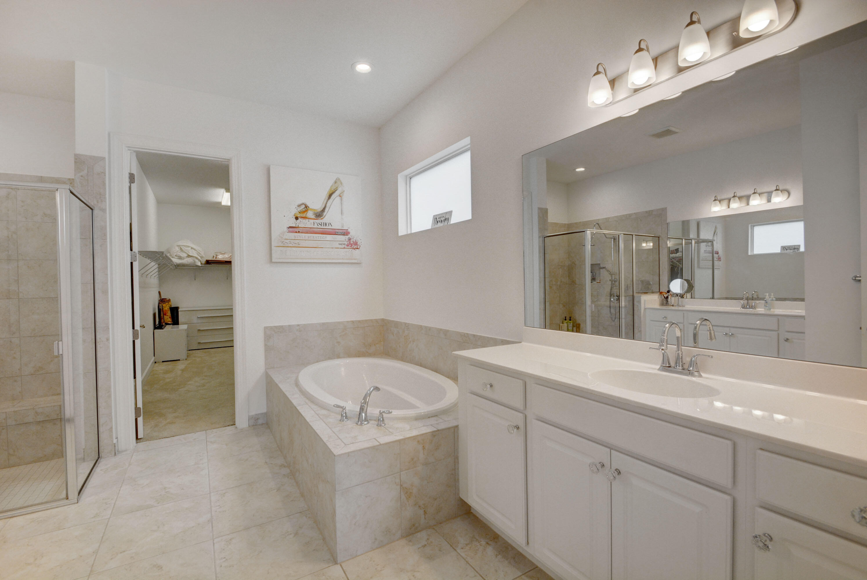 5251 Beland Drive Lake Worth, FL 33467 - Photo 31 of 56 a bathroom with a sink double vanity granite tub shower and a mirror
