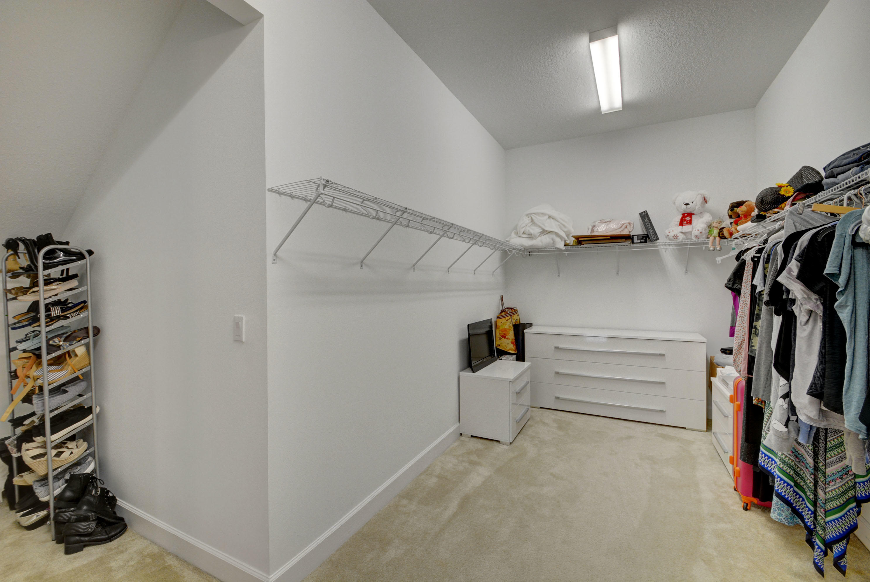 5251 Beland Drive Lake Worth, FL 33467 - Photo 33 of 56 a view of walk in closet with clothes and shoes