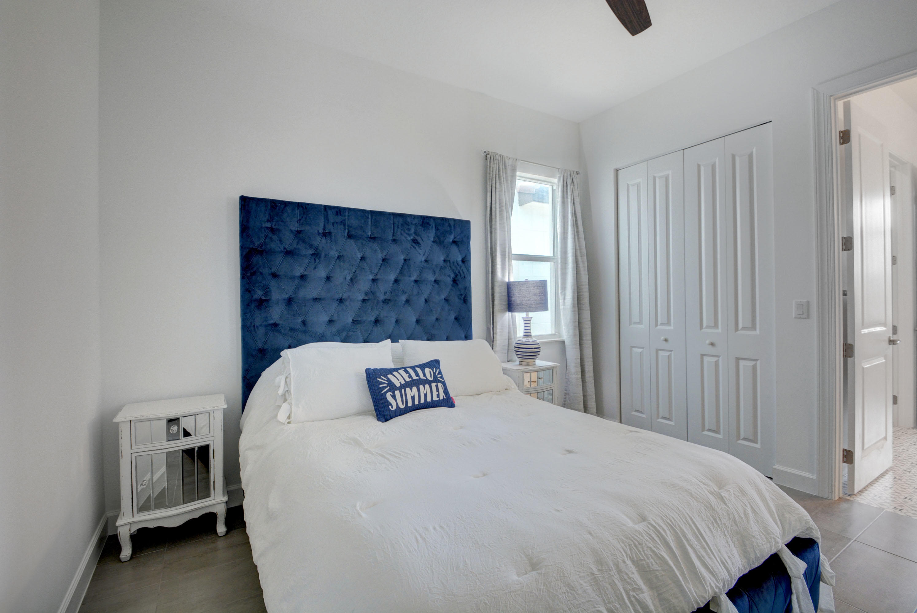 5251 Beland Drive Lake Worth, FL 33467 - Photo 36 of 56 a bedroom with a bed and a window