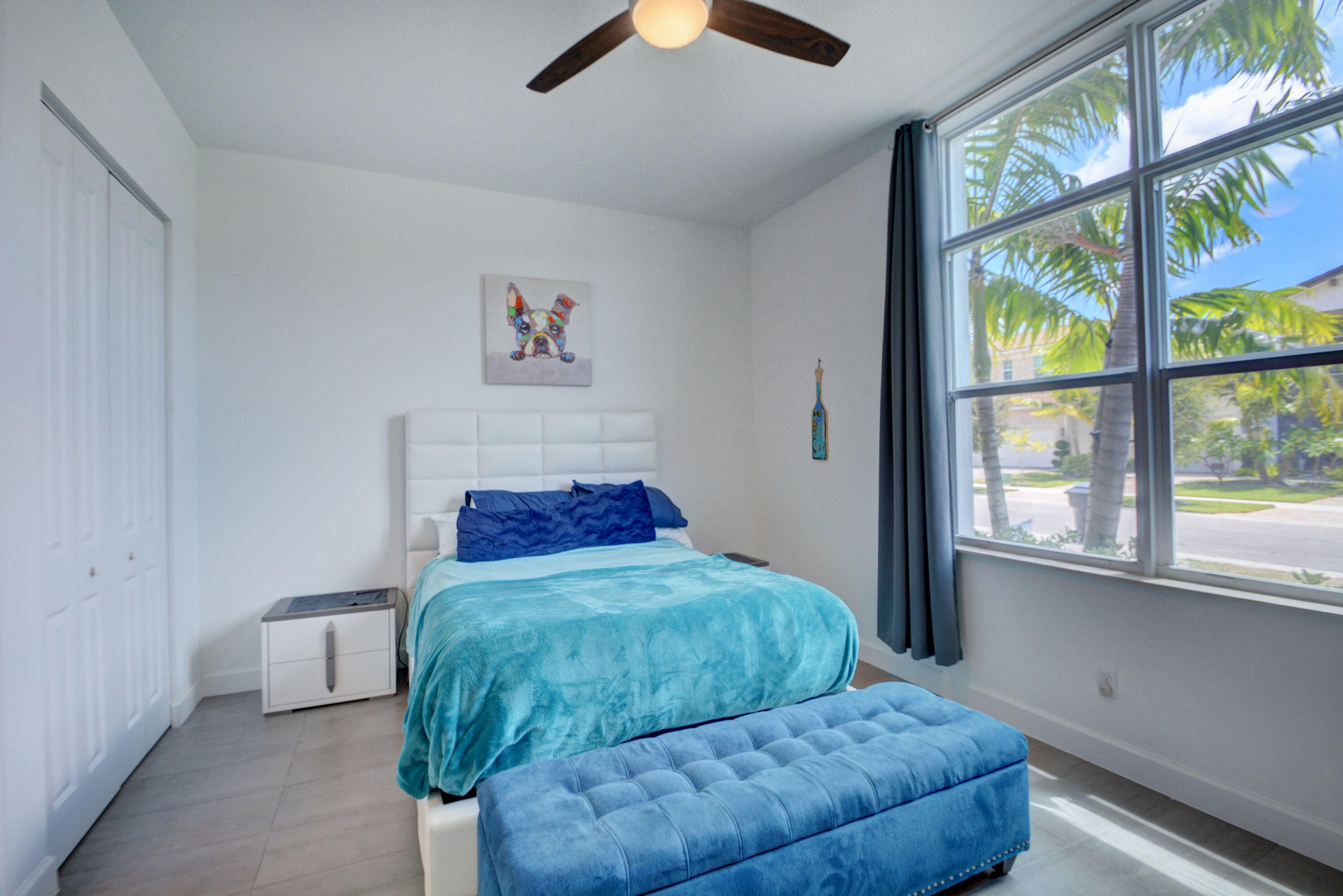 5251 Beland Drive Lake Worth, FL 33467 - Photo 40 of 56 a bedroom with furniture and a large window