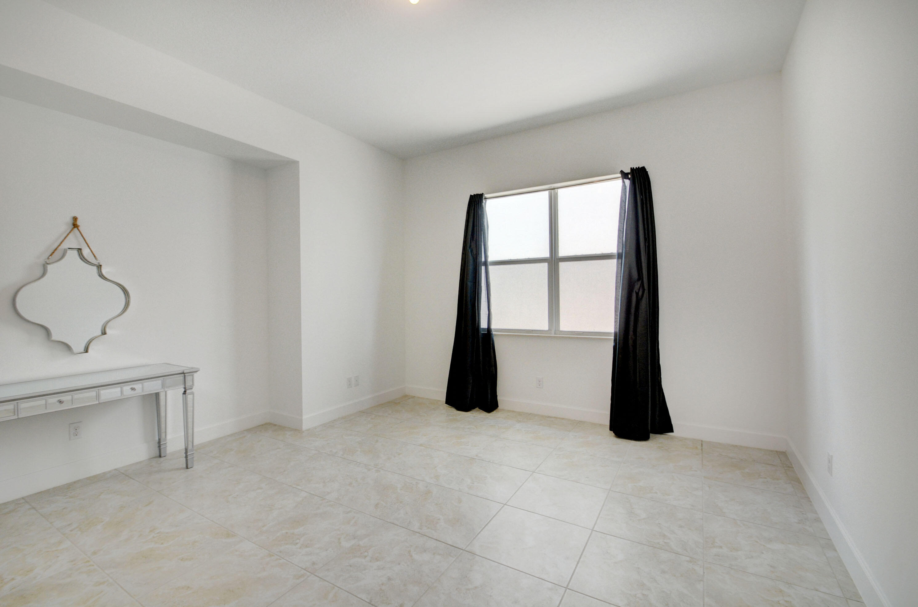 5251 Beland Drive Lake Worth, FL 33467 - Photo 45 of 56 a view of an empty room with a window