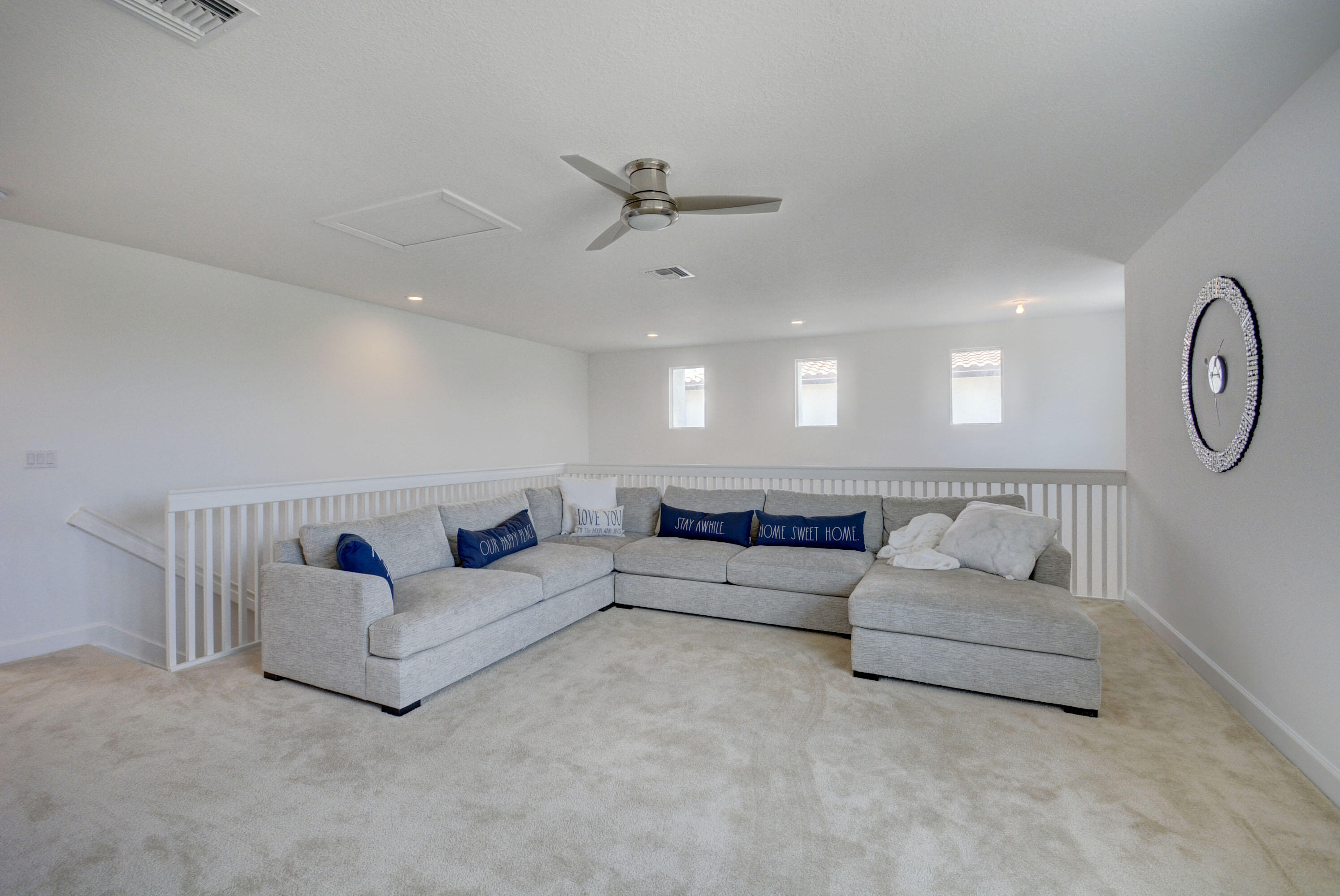 5251 Beland Drive Lake Worth, FL 33467 - Photo 47 of 56 a living room with furniture a ceiling fan and a rug