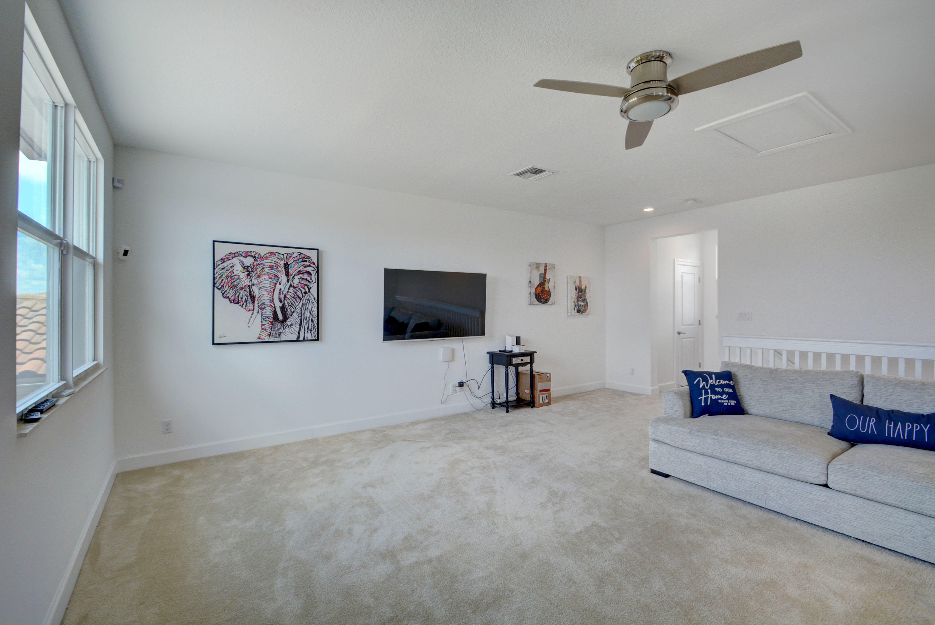 5251 Beland Drive Lake Worth, FL 33467 - Photo 50 of 56 a living room with furniture and a flat screen tv
