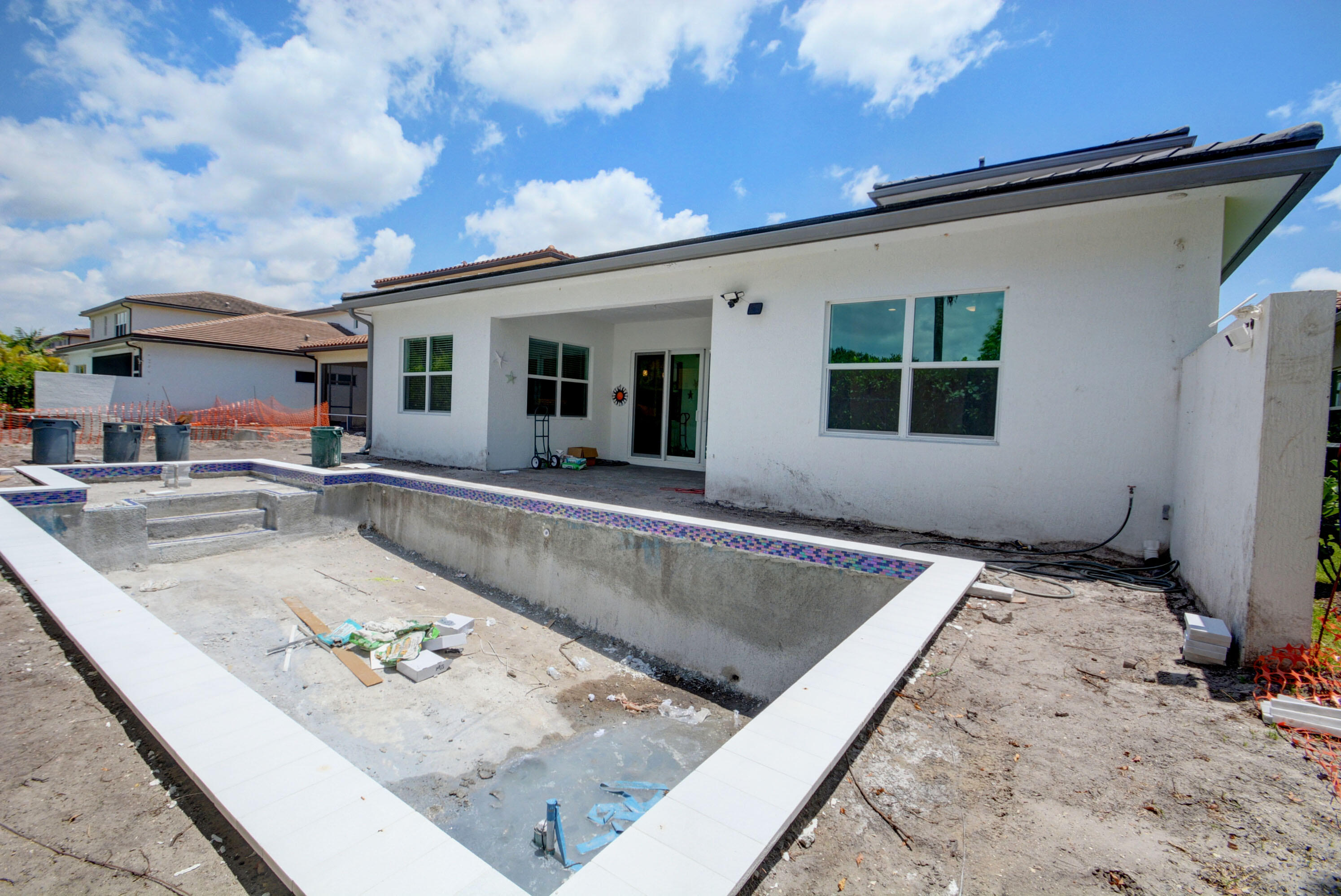 5251 Beland Drive Lake Worth, FL 33467 - Photo 53 of 56 a view of a house with pool and sitting area