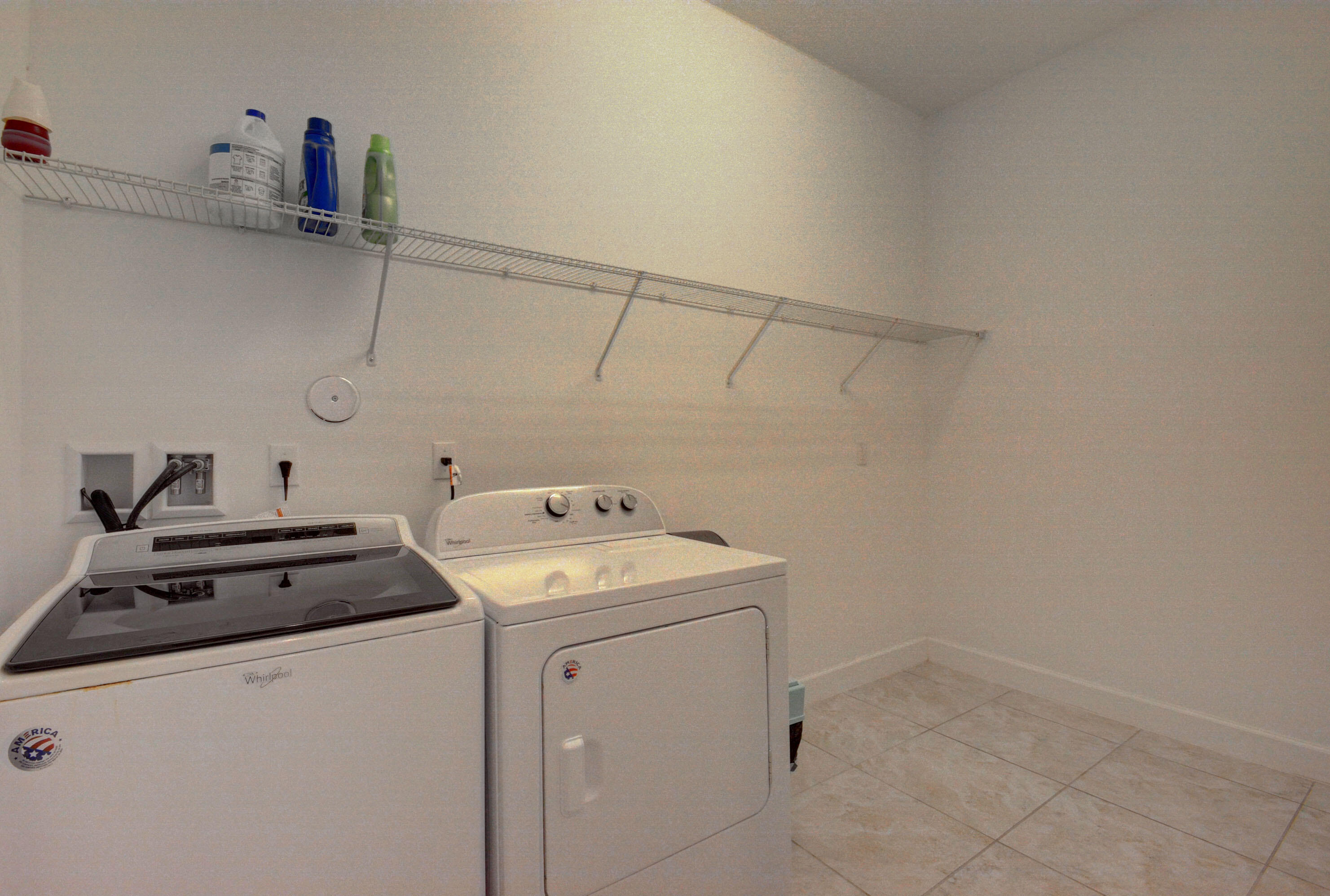5251 Beland Drive Lake Worth, FL 33467 - Photo 56 of 56 a utility room with dryer and washer