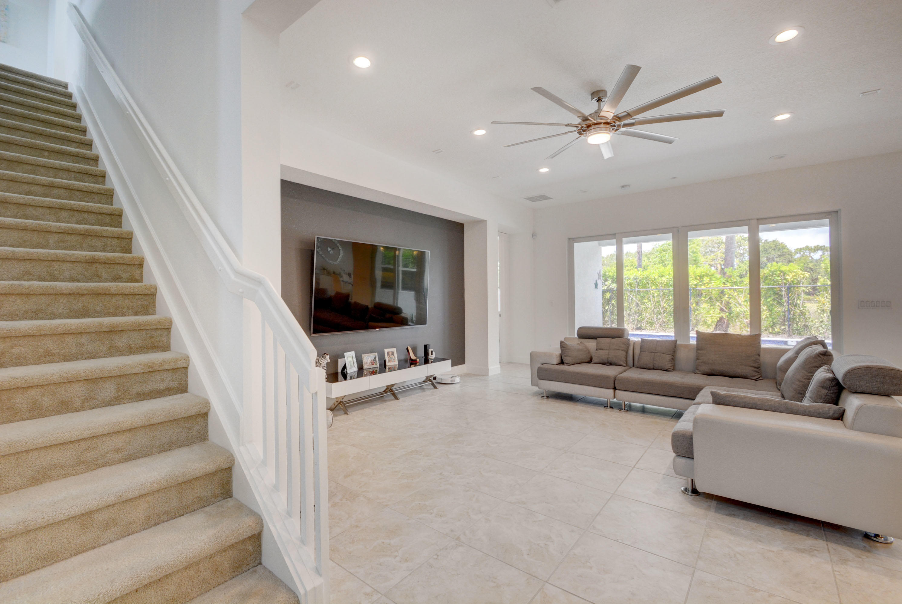 5251 Beland Drive Lake Worth, FL 33467 - Photo 8 of 56 a living room with furniture and a flat screen tv