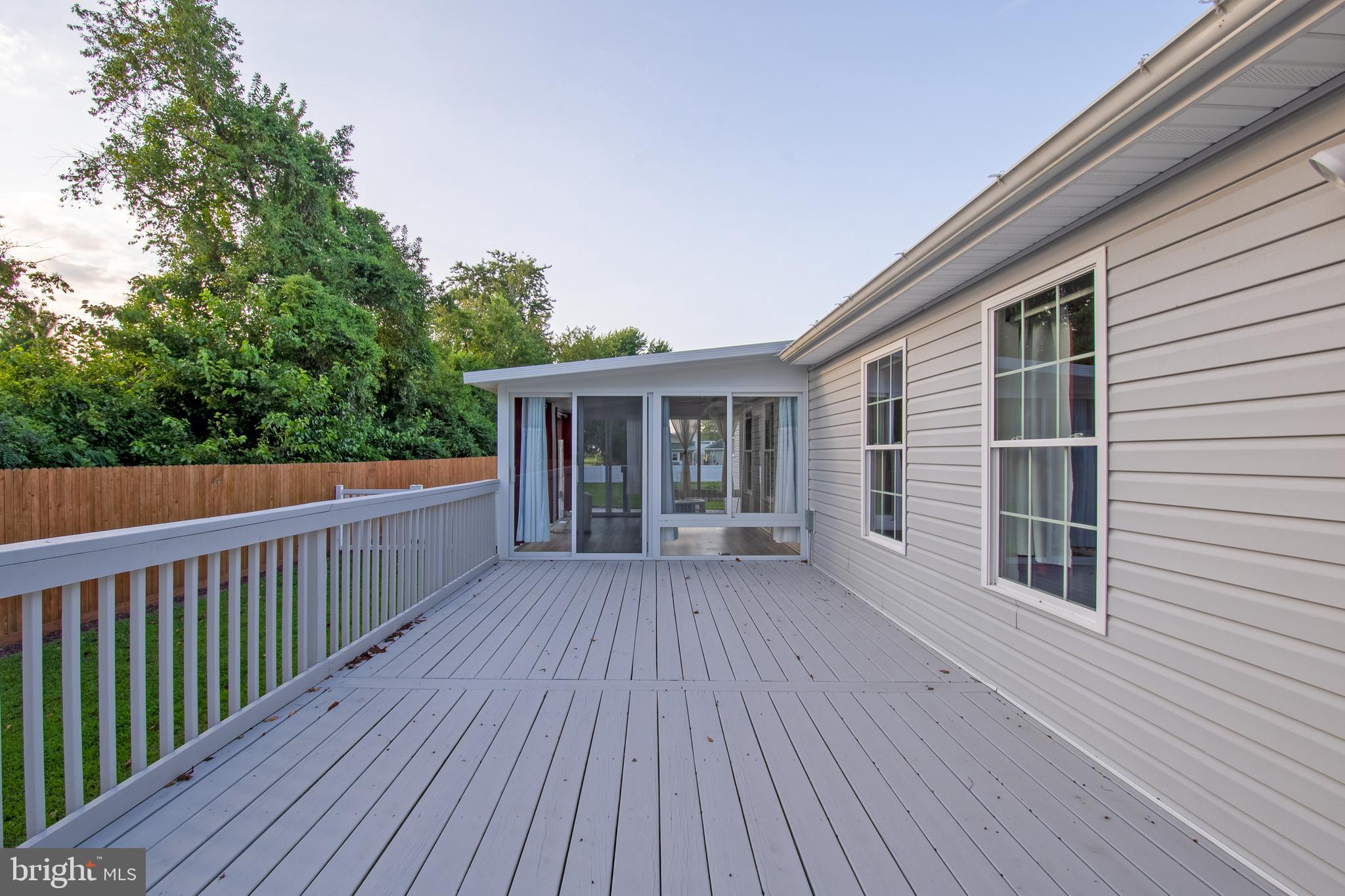 54 Minner Street Houston, DE 19954 - Photo 11 of 55 a view of backyard with deck and wooden floor