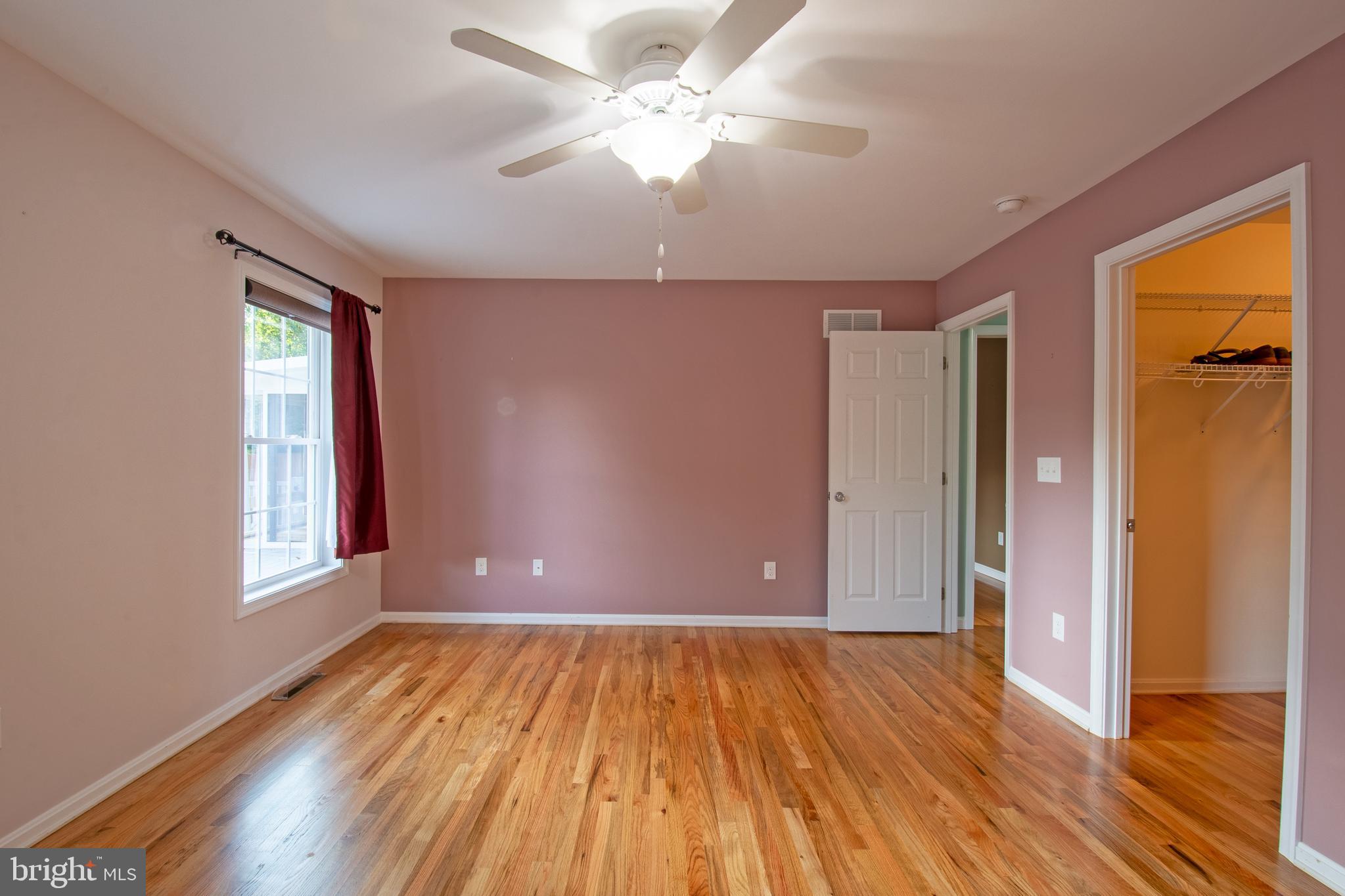 54 Minner Street Houston, DE 19954 - Photo 30 of 55 a view of an empty room with window and wooden floor