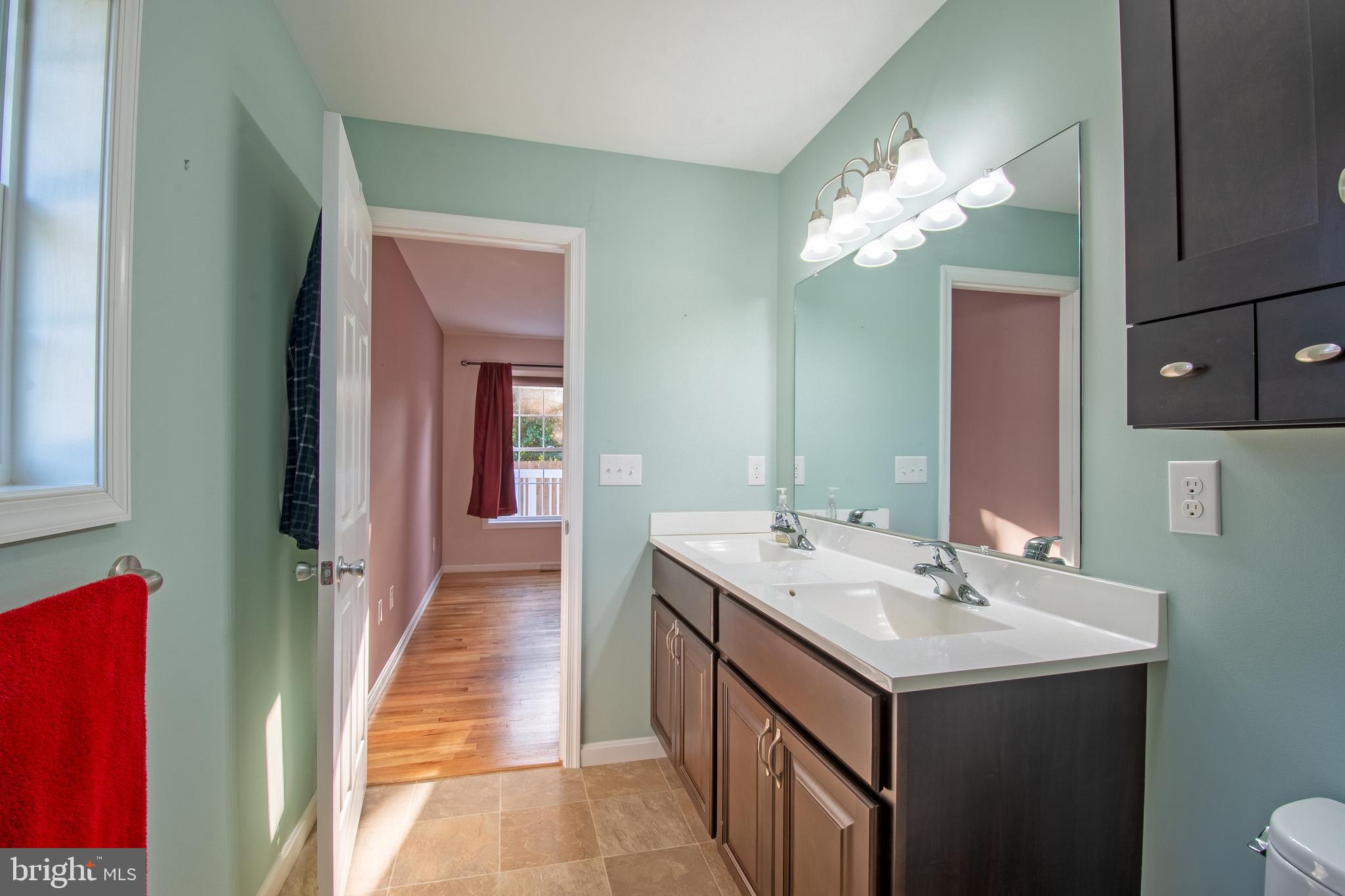 54 Minner Street Houston, DE 19954 - Photo 32 of 55 a bathroom with a sink and a mirror